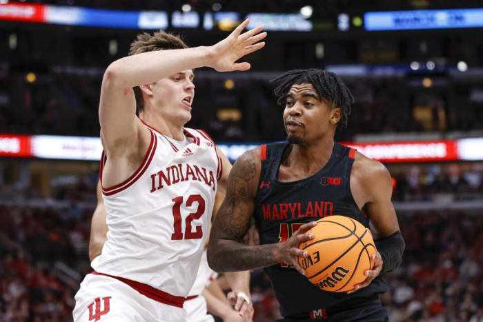 Maryland Terrapins guard Hakim Hart (13) drives to the basket against Indiana Hoosiers forward Miller Kopp (12) during the first half at United Center.